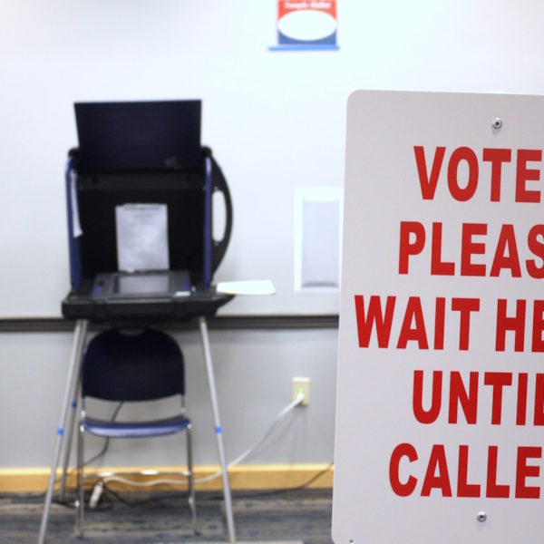 Nashville polling place with a "voter please wait here until called" sign