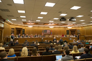 State senators meet in a committee room of Legislative Plaza.