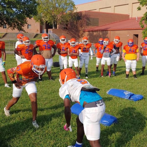 Football players at Hunters Lane High School square off on their first day of practice this fall.