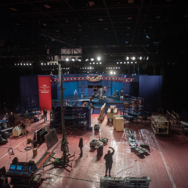 Crews build the stage for the presidential debate at Belmont University.