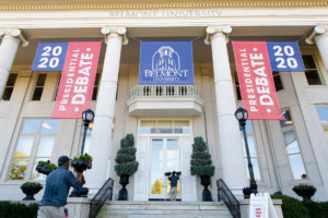 Banners for the presidential debate hang from a building on the campus of Belmont University.