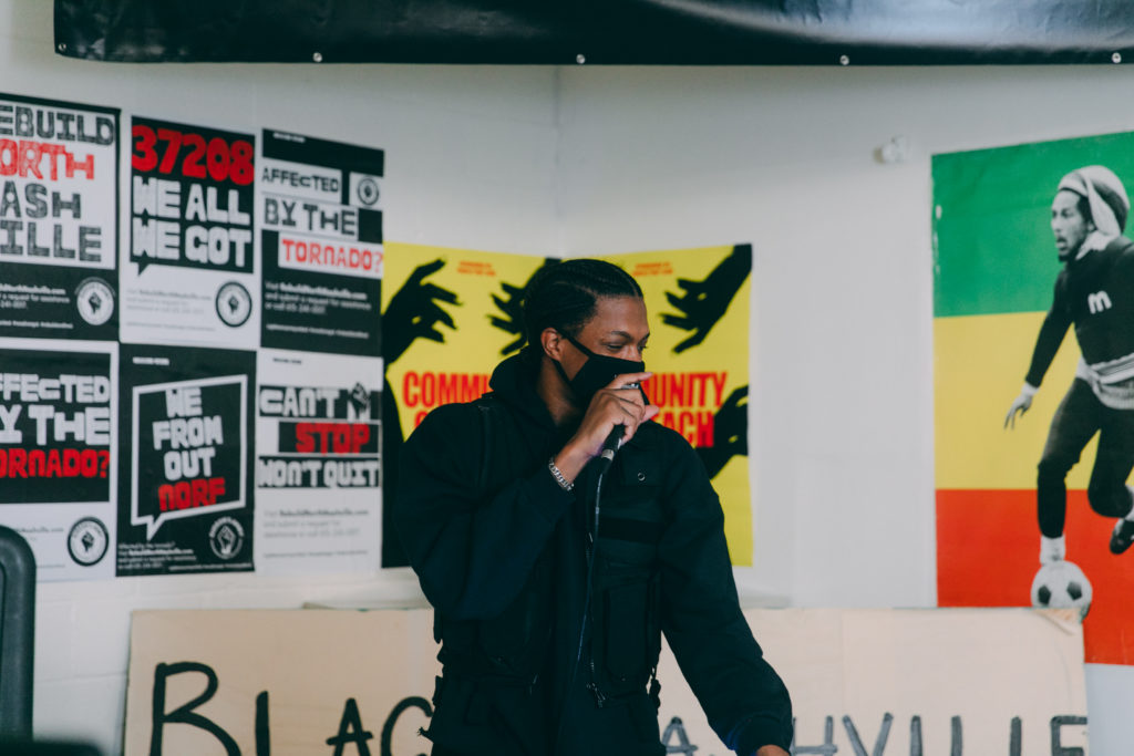 Mike Floss spins music at a Black Nashville Assembly meeting.