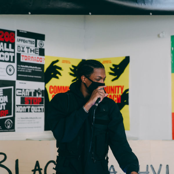 Mike Floss spins music at a Black Nashville Assembly meeting.