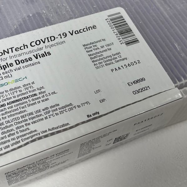 A box of vials containing the COVID-19 vaccine