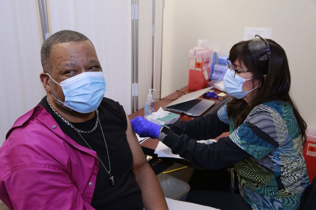 Veteran getting vaccine