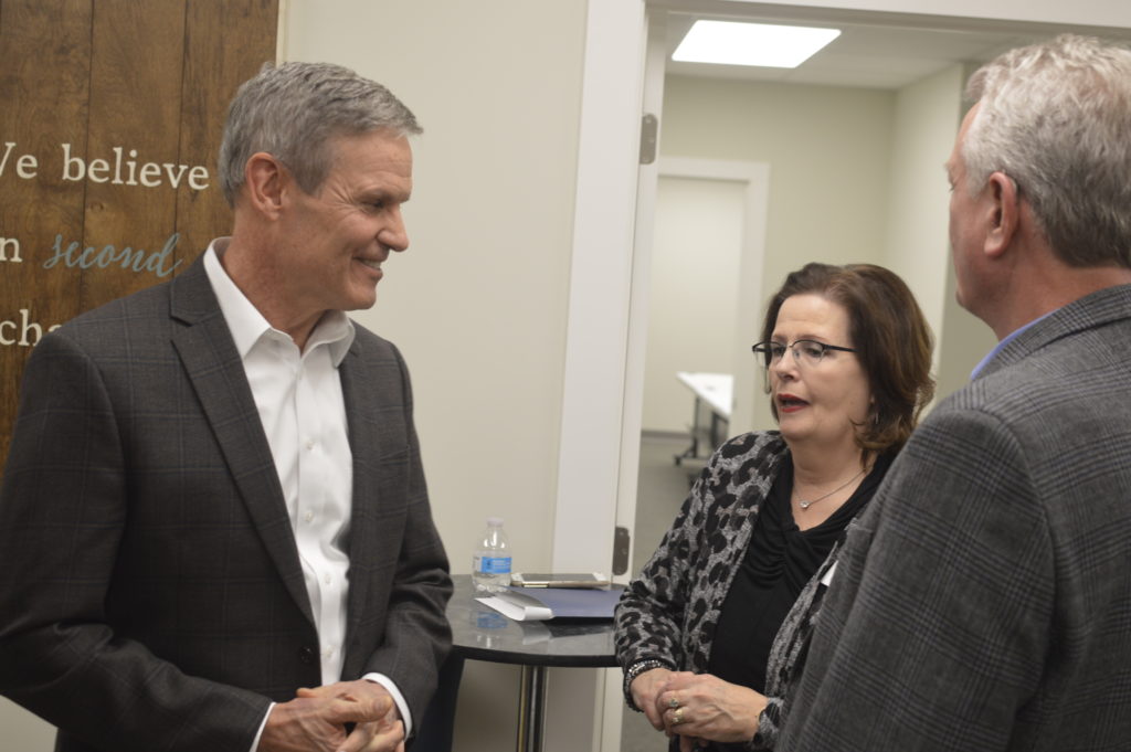 Gov. Bill Lee speaking with Portico Executive Director Laura Messick.