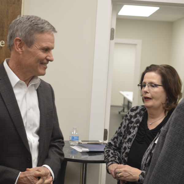 Gov. Bill Lee speaking with Portico Executive Director Laura Messick.