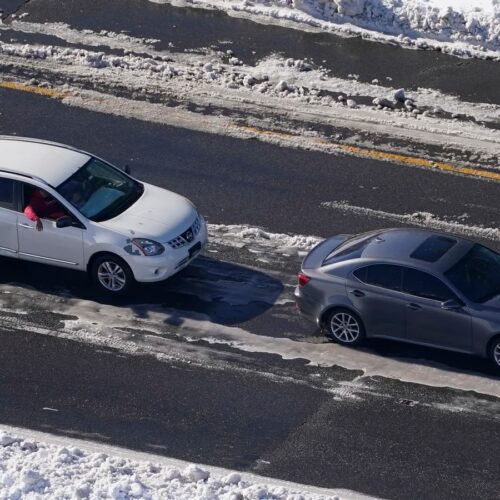 Stranded motorists wait for a tow on Interstate 95 in 2022 in Ladysmith, Va. A massive winter storm closed about 48 miles of the interstate.