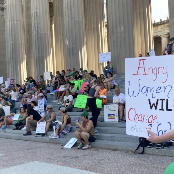 angry women will change the world sign