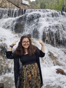 Dereen in front of a waterfall in Kurdistan.