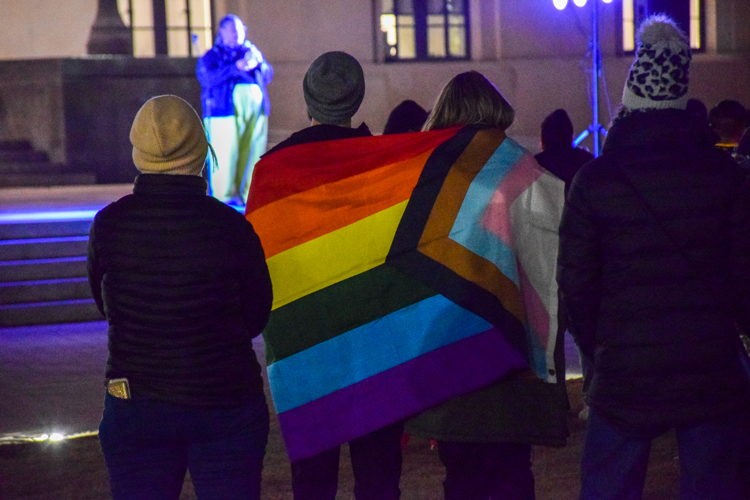 Two people wrapped in a pride flag attend a vigil Nashville for the victims of a mass shooting at an LGBT+ nightclub in Colorado Springs, Colorado on Nov. 19, 2022.