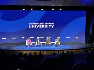 Bill, Hillary and Chelsea Clinton on stage