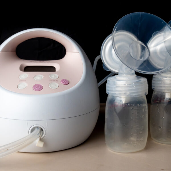 The photo shows a breast pump device