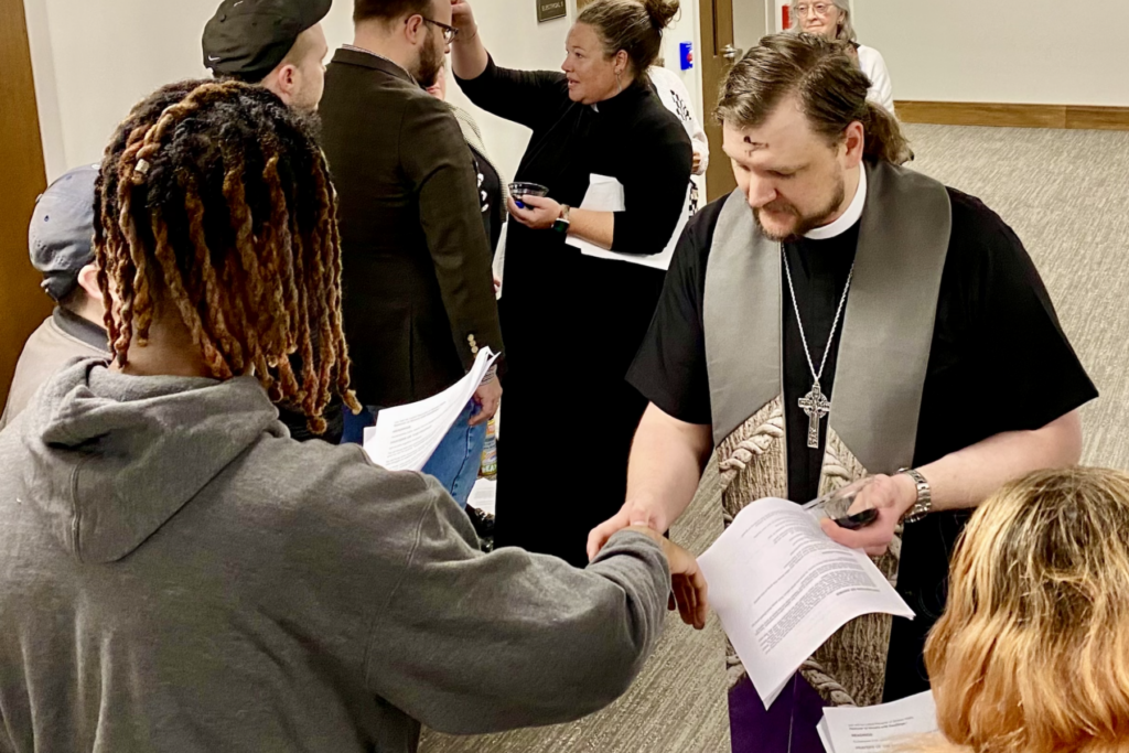 At the TN State Capitol on Ash Wednesday, Rev. Travis Meier (right) and Pastor Ingrid McIntyre use ashes to place a symbol of a cross on observants' foreheads.