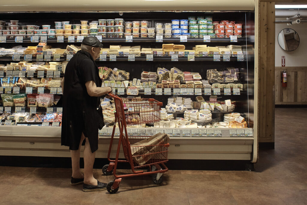Man shops at a grocery store.