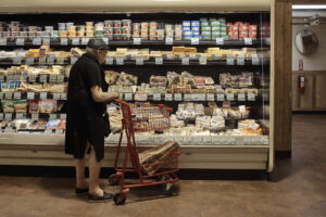 Man shops at a grocery store.