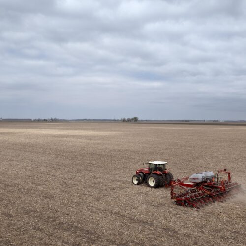 Dan Duffy uses a tractor to plant soybeans on land he farms with his brother on April 28, 2025 near Dwight, Illinois.