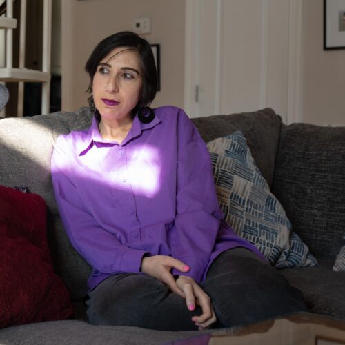 Tamar Shirinian sits on the couch in her Knoxville home on Wednesday, Nov. 26, 2025. Shirinian is a cultural anthropologist who had previously worked for 6 years as an assistant professor at the University of Tennessee until she was fired for making a private Facebook comment critical of conservative activist Charlie Kirk after his Sept. 10 assassination.