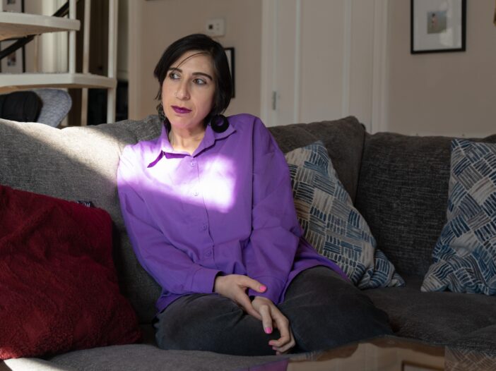 Tamar Shirinian sits on the couch in her Knoxville home on Wednesday, Nov. 26, 2025. Shirinian is a cultural anthropologist who had previously worked for 6 years as an assistant professor at the University of Tennessee until she was fired for making a private Facebook comment critical of conservative activist Charlie Kirk after his Sept. 10 assassination.