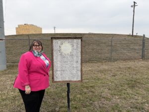 Sonia Fernandez LeBlanc in front of grassy mound