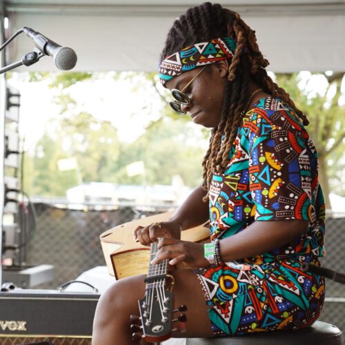 Yasmin Williams, seen here performing during the 2022 Pilgrimage Music & Cultural Festival in Franklin, Tenn., had a confrontation last year with the interim president of the Kennedy Center, where she had been scheduled to perform, over the institution's rollback of DEI initiatives. Williams did not cancel her performance.