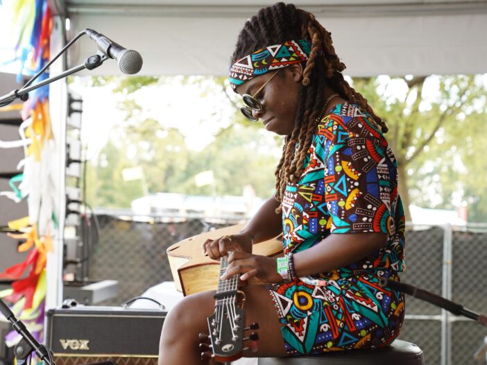 Yasmin Williams, seen here performing during the 2022 Pilgrimage Music & Cultural Festival in Franklin, Tenn., had a confrontation last year with the interim president of the Kennedy Center, where she had been scheduled to perform, over the institution's rollback of DEI initiatives. Williams did not cancel her performance.