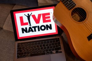 The Live Nation logo on a laptop arranged in San Francisco, California, US, on Monday, March 9, 2026. Live Nation Entertainment Inc. reached a surprise settlement with federal antitrust authorities, creating a chaotic courtroom scene that angered the judge and sparked a chorus of criticism from rivals, lawmakers and state attorneys general that had joined the case. Photographer: David Paul Morris/Bloomberg via Getty Images