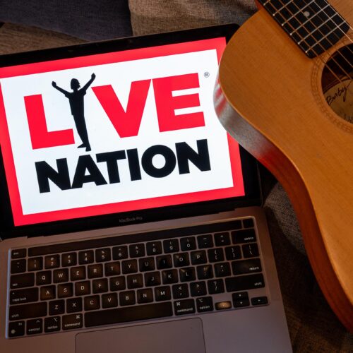 The Live Nation logo on a laptop arranged in San Francisco, California, US, on Monday, March 9, 2026. Live Nation Entertainment Inc. reached a surprise settlement with federal antitrust authorities, creating a chaotic courtroom scene that angered the judge and sparked a chorus of criticism from rivals, lawmakers and state attorneys general that had joined the case. Photographer: David Paul Morris/Bloomberg via Getty Images