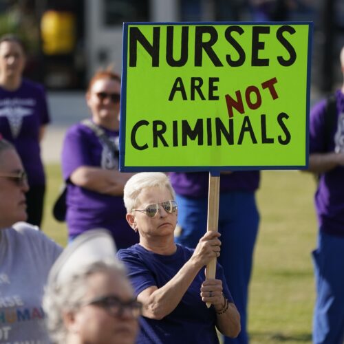 People demonstrate outside the courthouse where the sentencing hearing for former nurse RaDonda Vaught was held on May 13, 2022, in Nashville, Tenn.