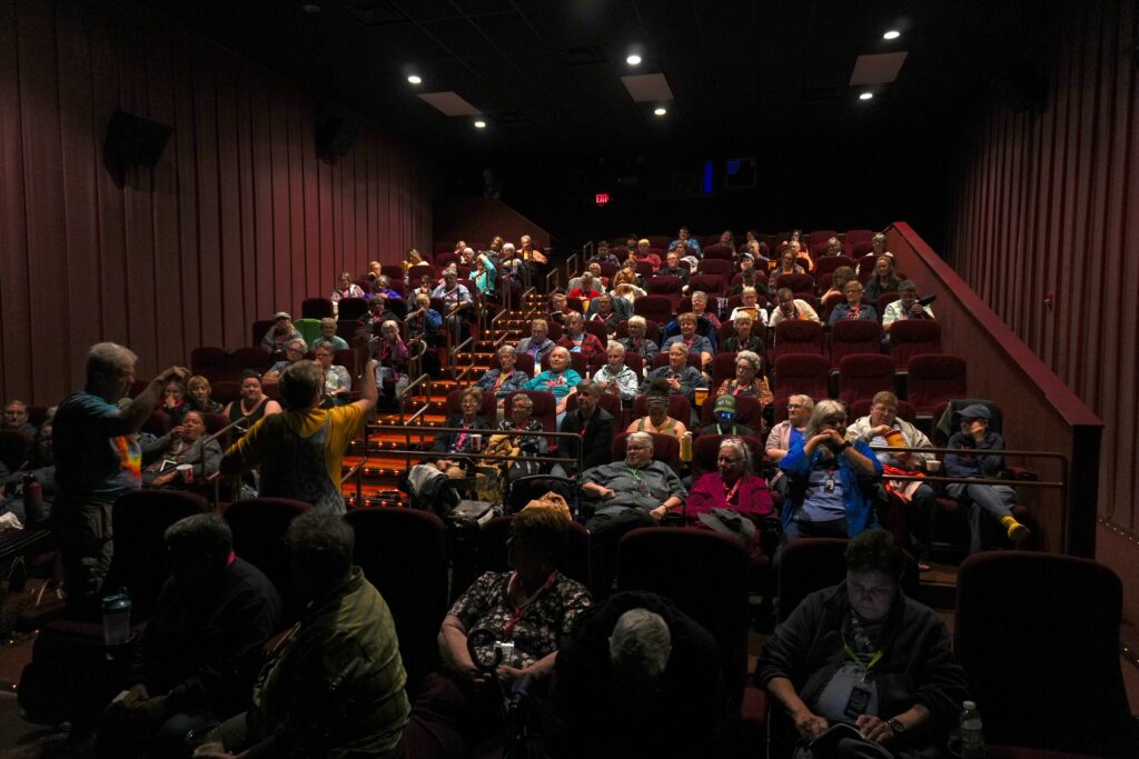 A theater full of people for a film screening.