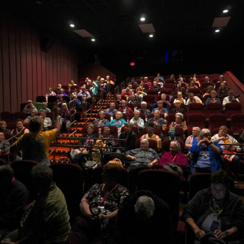 A theater full of people for a film screening.