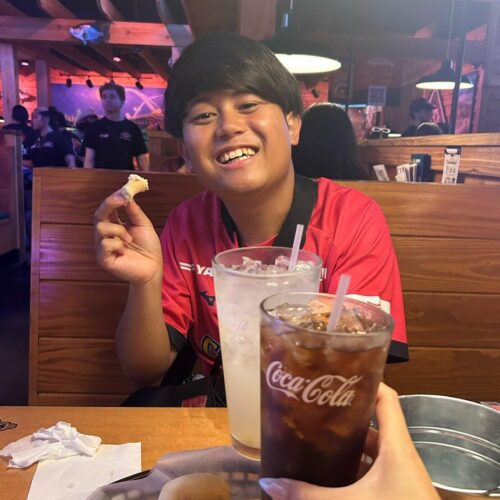 Rinta Goto, a tourist from Japan, enjoys what he describes as "insanely good" bread at Texas Roadhouse in Dallas.