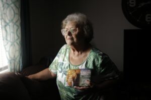 Cindy Leachman Aldridge holds a photo of her late grandson, Jonah Neal, at her home on Wednesday, July 12, 2026 in Owensboro, Ky. Neal was killed in May in Memphis, Tenn. by a federal agent from a crime-fighting task force that includes agents from Homeland Security Investigations and members of the Tennessee National Guard.