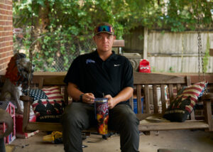 Thomas Jarvis on the porch of the home he shares with his mother and grandmother, one year after his release from the Tennessee juvenile justice system.