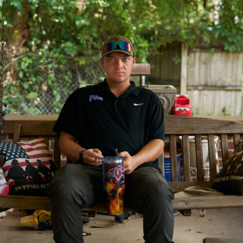 Thomas Jarvis on the porch of the home he shares with his mother and grandmother, one year after his release from the Tennessee juvenile justice system.