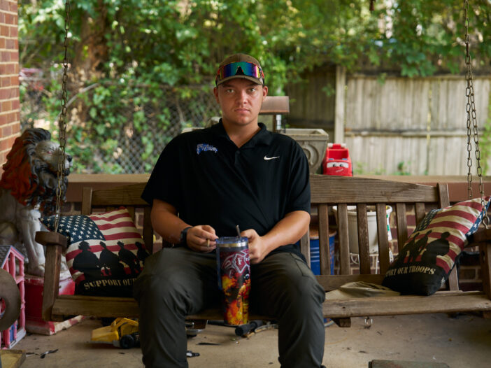 Thomas Jarvis on the porch of the home he shares with his mother and grandmother, one year after his release from the Tennessee juvenile justice system.