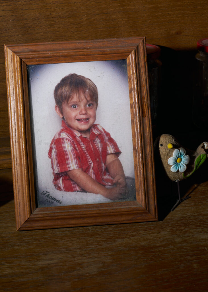 A photogrpah of Thomas Jarvis as a child on a table at his grandmothers home.