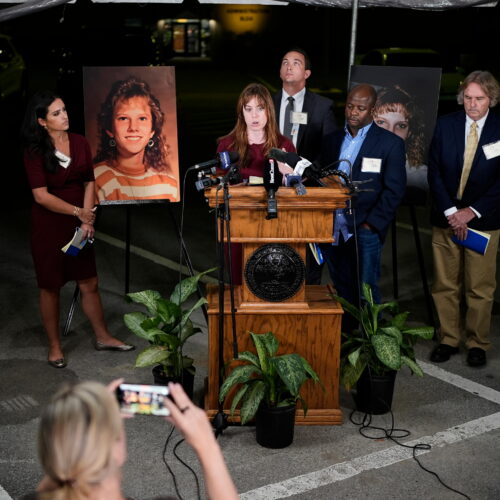 Public radio reporter Catherine Sweeney, one of the media witnesses, recounts the moments before the execution of Christa Pike was halted last Wednesday, Sept. 30. (AP Photo/George Walker IV) Flanking the podium are two photos of Colleen Slemmer, Pike's victim in the 1995 murder.