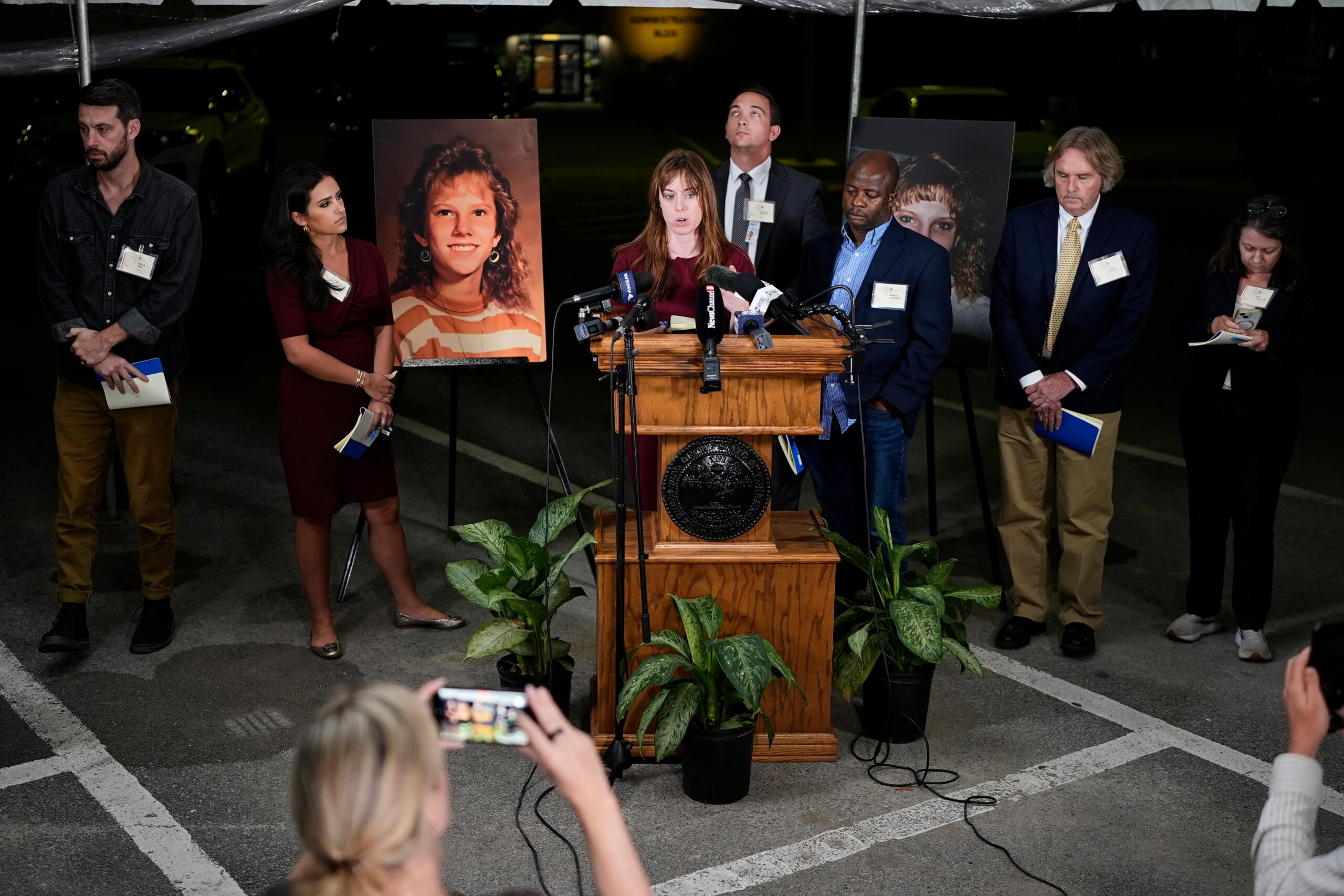 Public radio reporter Catherine Sweeney, one of the media witnesses, recounts the moments before the execution of Christa Pike was halted last Wednesday, Sept. 30. (AP Photo/George Walker IV) Flanking the podium are two photos of Colleen Slemmer, Pike's victim in the 1995 murder.